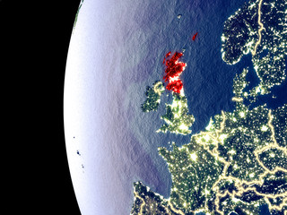 Night view of Scotland from space with visible city lights. Very detailed plastic planet surface.