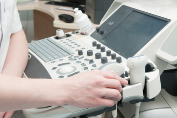 Doctor's hands with ultrasound machine