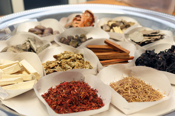 Dried Herbs in paper tray for sacrificial offering or alternative medicine asian thai traditional therapy.