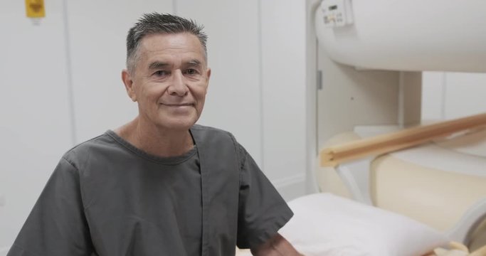 Portrait Of Happy Senior Man Smiling As Patient In Hospital