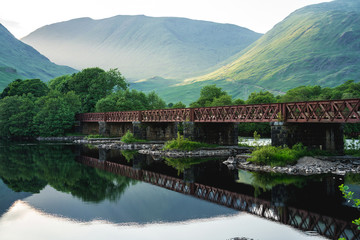 Old metal bridge among scottish scenery, Scotland, UK.