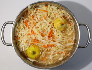 Sauerkraut in a large metal pan.