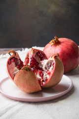 cut juicy pomegranate on a plate
