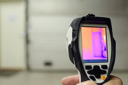 Thermal imaging camera, checking heat leaks at the warehouse. Copy space.