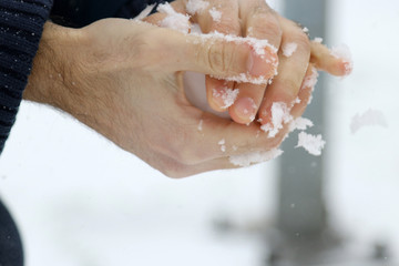 Man making snowballs