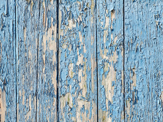 Background wooden wall, covered with paint peels off