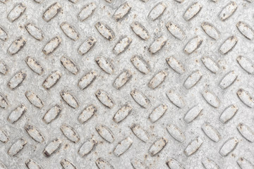 Steel sheet with notches - gray vintage metal abstract light coloured background, texture close-up