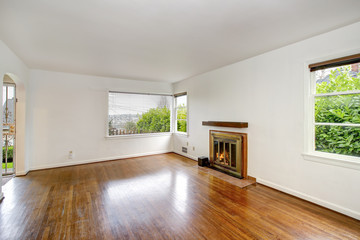 Empty craftsman style living room interior with fireplace.