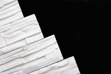 Gypsum decorative white bricks for finishing the walls after repair. Minimalist style. Work of the...
