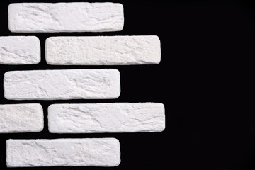 Gypsum decorative white bricks for finishing the walls after repair. Minimalist style. Work of the...