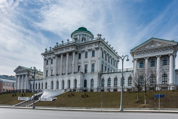 Pashkov House, a building of Russian State Library, and Mokhovaya street in spring sunny day.