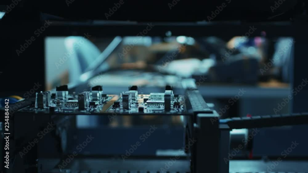 Poster automated robotic industrial equipment is testing electronic printed circuit board with light and la