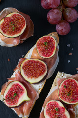 whole bread with cheese, parma ham and figs