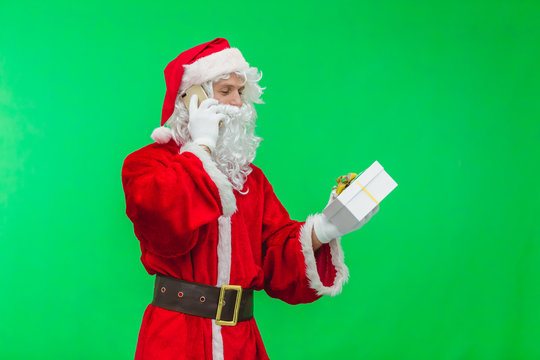 Santa Claus calling phone Portrait Isolated on green Background
