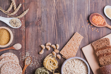 Different types of high carbohydrate food on the wooden background