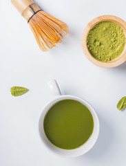 Traditional japanese green tea matcha in a cup, whisk and powder