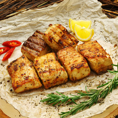 Fish kebab on wooden background