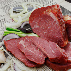 Dried bear, wild boar, deer on a wooden background