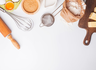 Tools and ingredients for baking: flour, eggs, sugar and other.