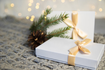 Two Christmas Gift in White Box with light Ribbon on Light Background. New Year Holiday Composition Banner. Copy Space For Your Text