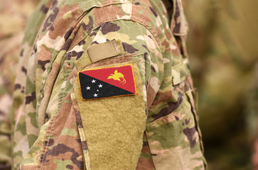 Papua New Guinea flag on soldiers arm. Papua New Guinea troops (collage)