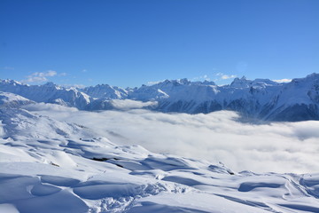 Alpine Panaorama in the winter with snow and clouds