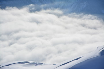 Alpine Panaorama in the winter with snow and clouds