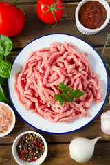 minced meat on wooden surface