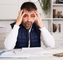 Distressed male having problems with paying utility bills