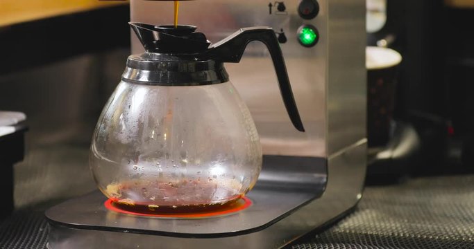 Timelapse of pouring tea in filter maker machine