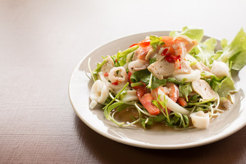 Thai Spicy salad with cuttlefish., shrimp, fish and vegetable