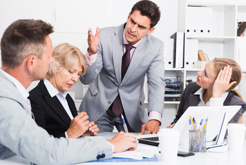 Irritated boss scolding subordinates