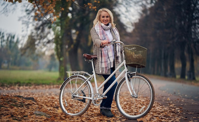 Senior woman in park in autumn