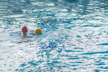 water polo competition in a pool for children and adolescents. water sports and swimming pool...