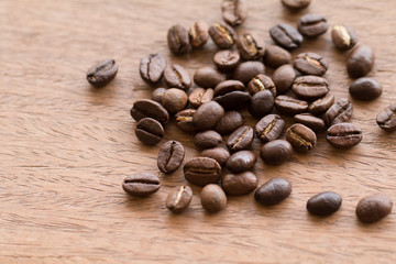 Close up of coffee beans on wooden desk