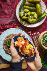 Lobio - traditional Georgian dish with red beans, cilantro, ajika spice served with pickles vegetables. Vegan vegetarian healthy food