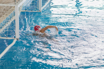 water polo competition in a pool for children and adolescents. water sports and swimming pool championship.