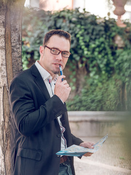 Businessman making notes on map
