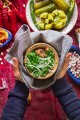 Lobio - traditional Georgian dish with red beans, cilantro, ajika spice served with pickles vegetables. Vegan vegetarian healthy food