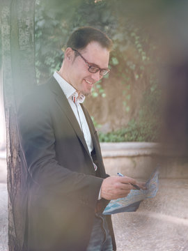 Businessman making notes on map