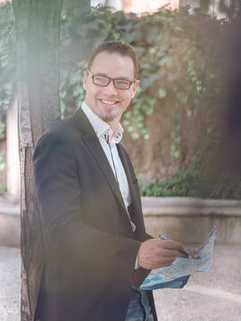 Businessman making notes on map