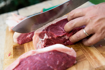Butcher preparing the meat picanha