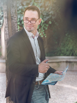 Businessman making notes on map