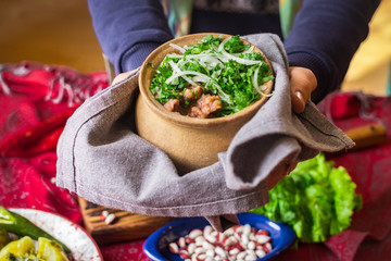 Lobio - traditional Georgian dish with red beans, cilantro, ajika spice served with pickles vegetables. Vegan vegetarian healthy food