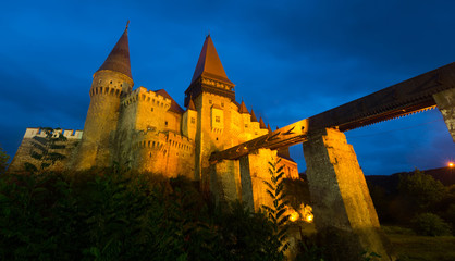 Illuminated Corvin Castle in night, Romania