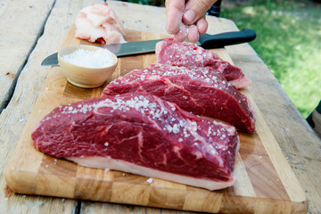 Cook salt the meat for the Picanha