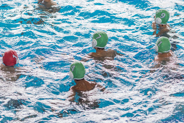 water polo competition in a pool for children and adolescents. water sports and swimming pool...
