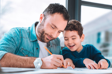 Joyful son enjoying time with the father