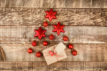 Christmas background with decorations and gift boxes on wooden board