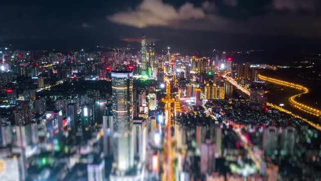 night illuminated famous shenzhen city downtown aerial panorama 4k tilt shift timelapse china
